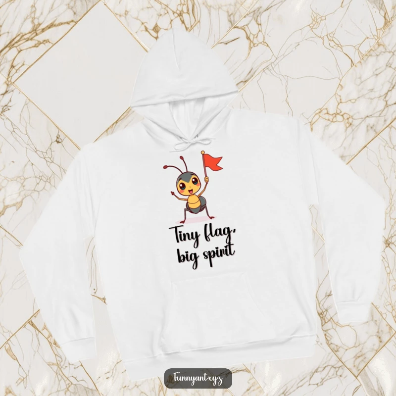 Funny hoodie with a cute ant character enthusiastically waving a tiny flag, conveying a spirit of celebration and unwavering positivity.