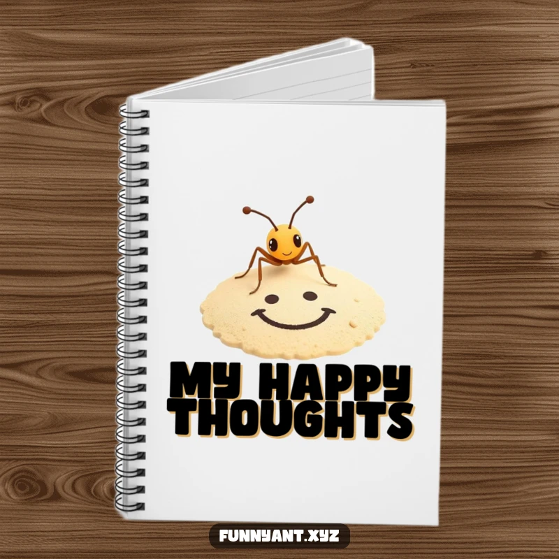 Funny notebook with a tiny ant artistically drawing a smiley face in the sand, ideal for jotting down humorous ideas.